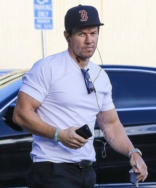 Travis Mathew's White T-shirt with grey pocket worn by Mark Wahlberg